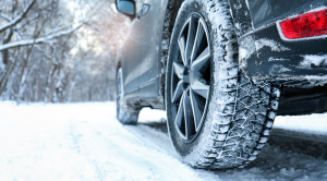 Close up of rear tire on a snowy road